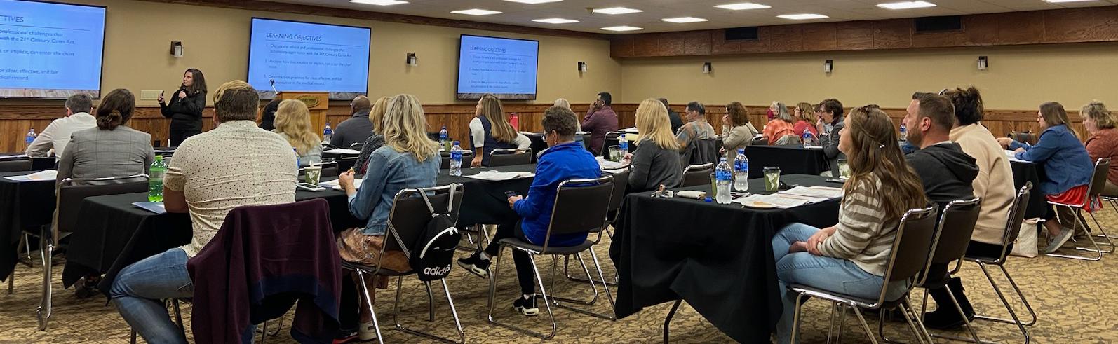 photo of adult learners at a symposium